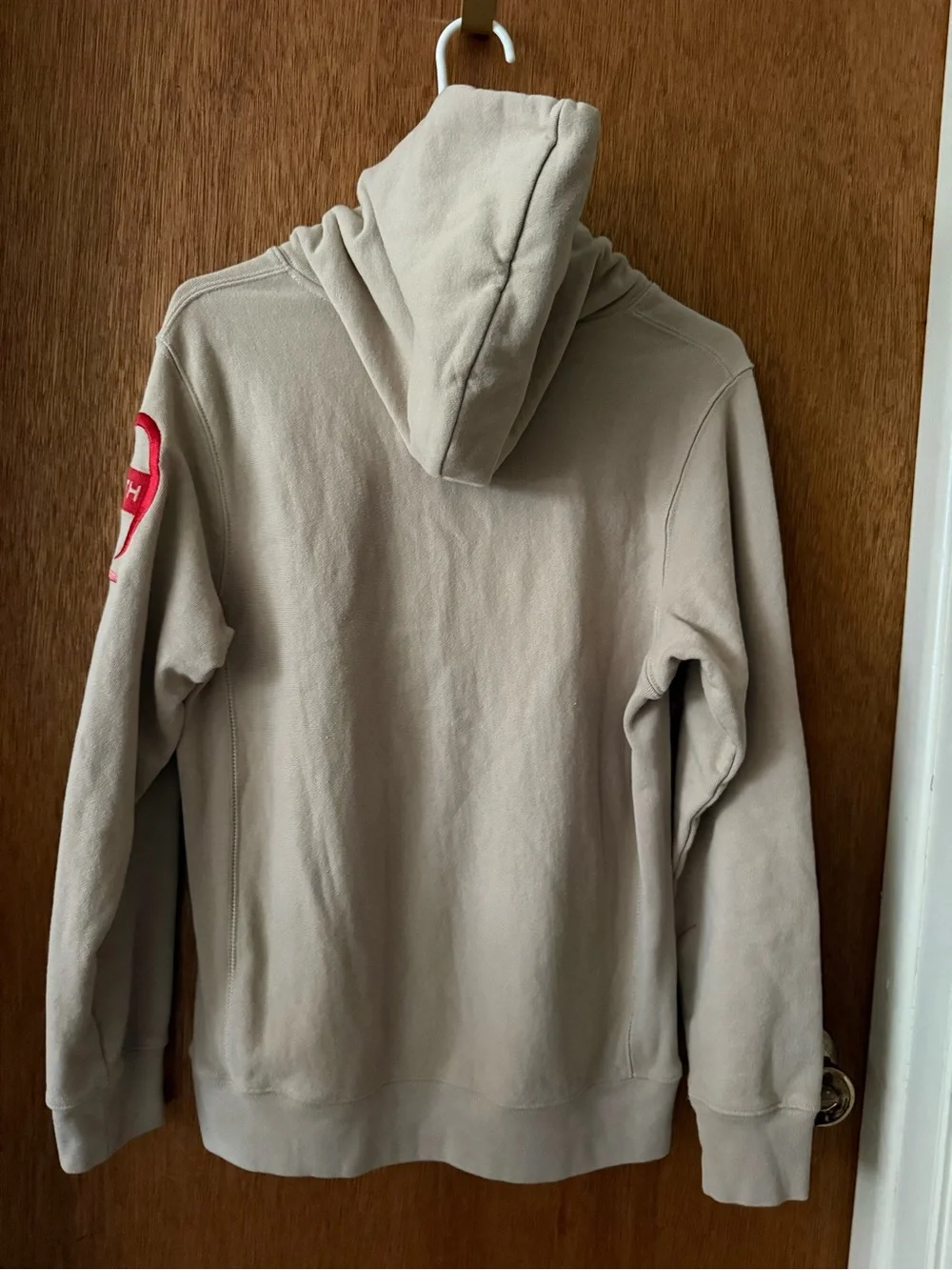 Kith and Champion Collab Beige Hoodie with Multicolor Sleeve Logo